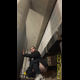 Miss Marilyn squats with her pants down under outdoor concrete stairs. No pooping shown. Presented in 720P vertical HD format. About a minute.